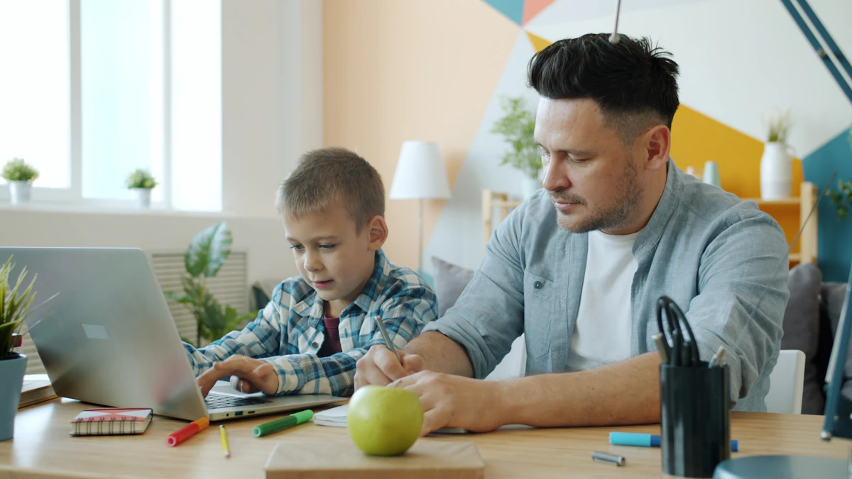 Parent and child working together on a laptop
