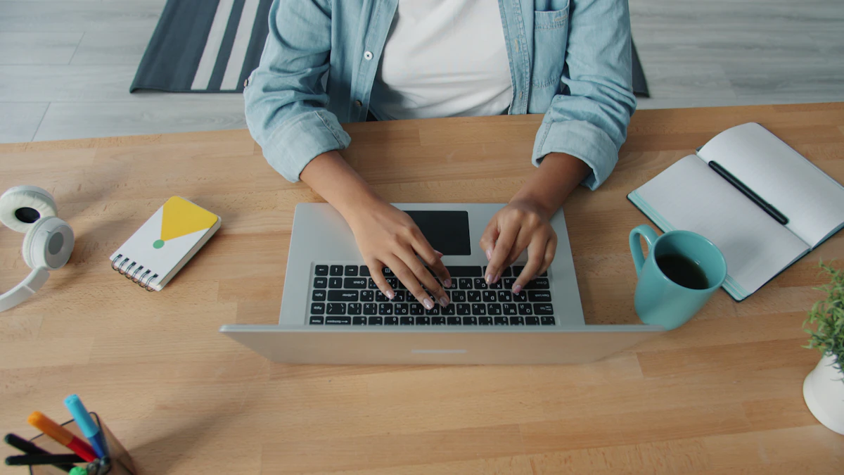 Woman working on a laptop at a wooden desk from home