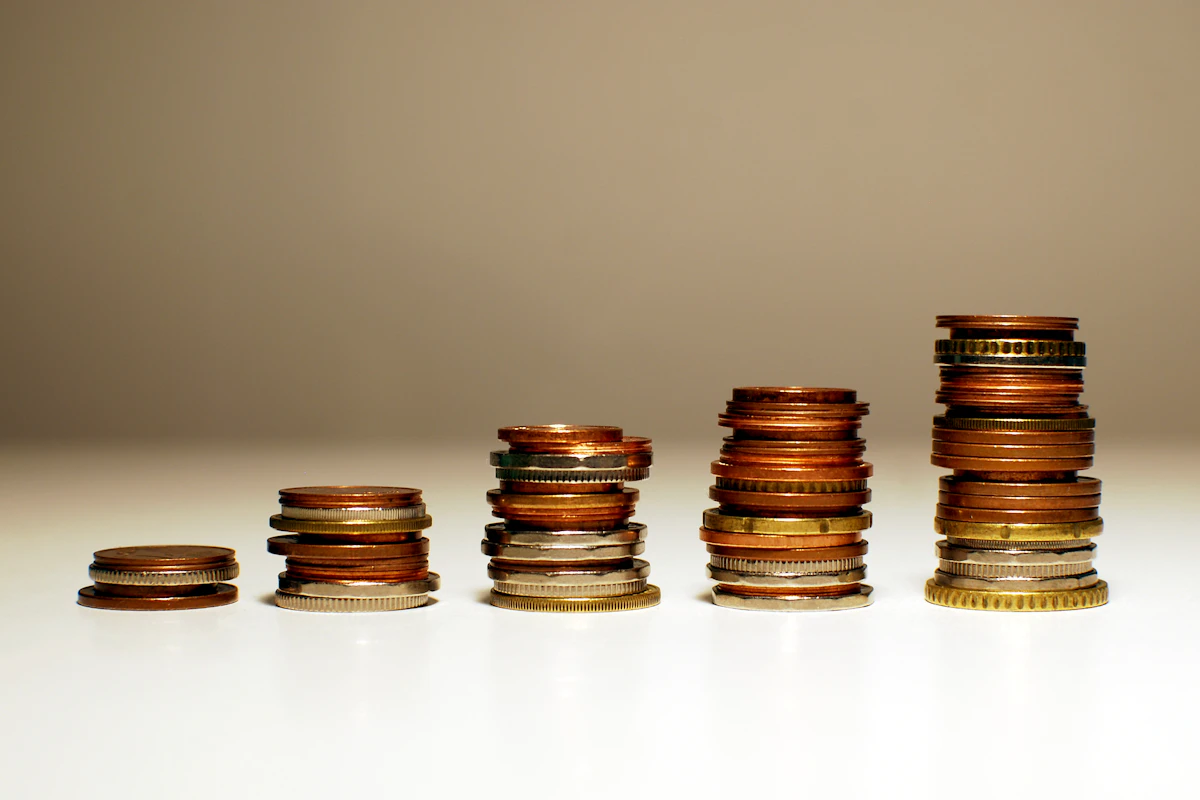 Stacks of coins increasing in height representing debt payoff progress